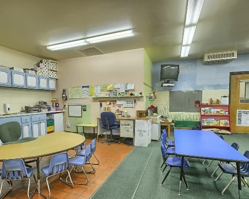classroom, blue tables and chairs