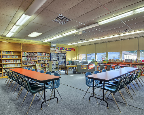 library, orange tables, blue chairs