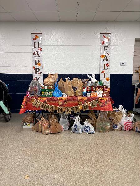 Food drive table full of donations