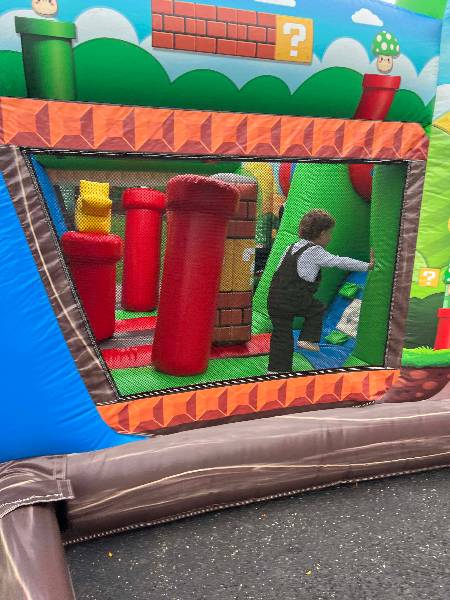 Child inside the video-game bounce house