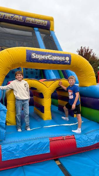 Two boys on the Vertical Rush inflatable
