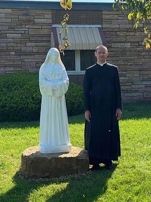 The statue was erected on the front lawn of our school statue, father