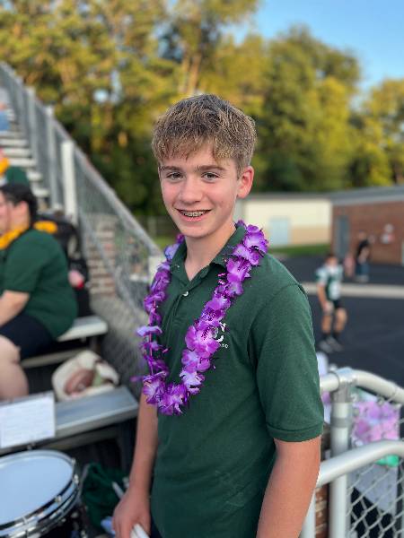 Drummer smiling by the stands