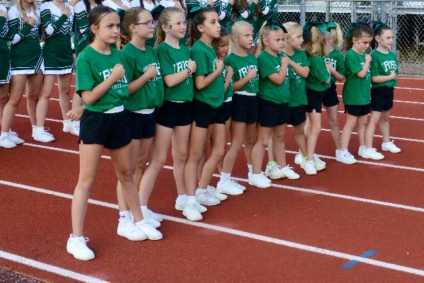 Irish cheerleaders stand for the national anthem