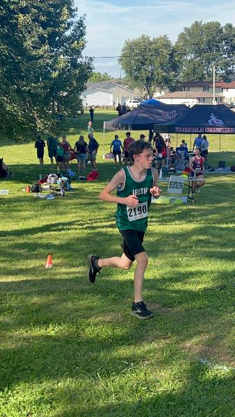 Irish runner passes the team tents