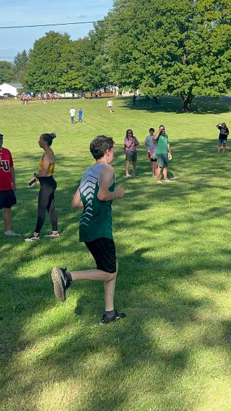 Irish runner heads down the course as fans cheer