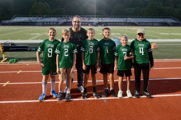Flag football players with their coach