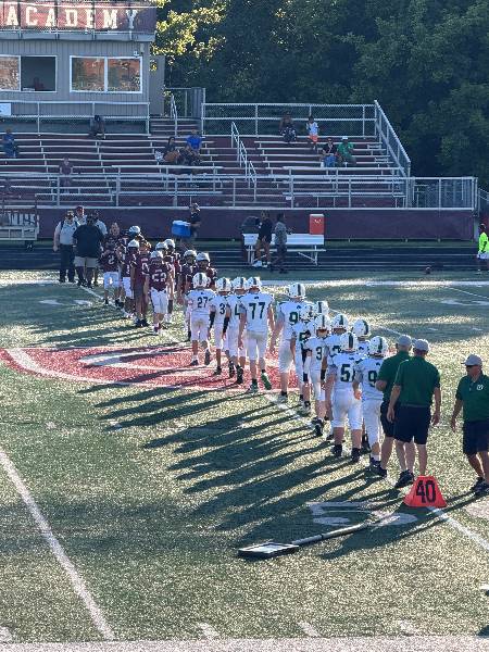 Irish and Columbus Academy players shake hands after the game