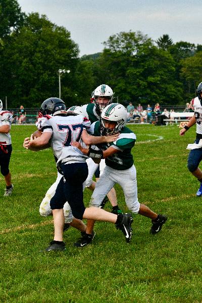 Irish defenders wrap up a ball carrier